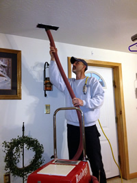 Image of Residential repair man clening HVAC ducts
